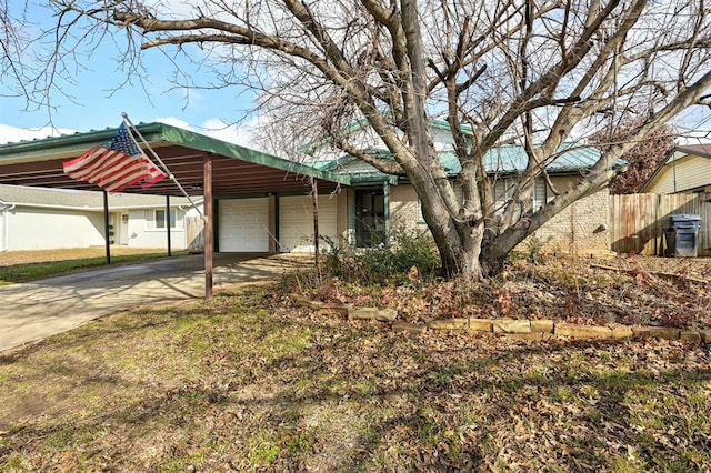 view of front of house featuring a garage and a carport