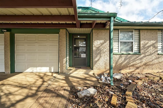 doorway to property featuring a garage