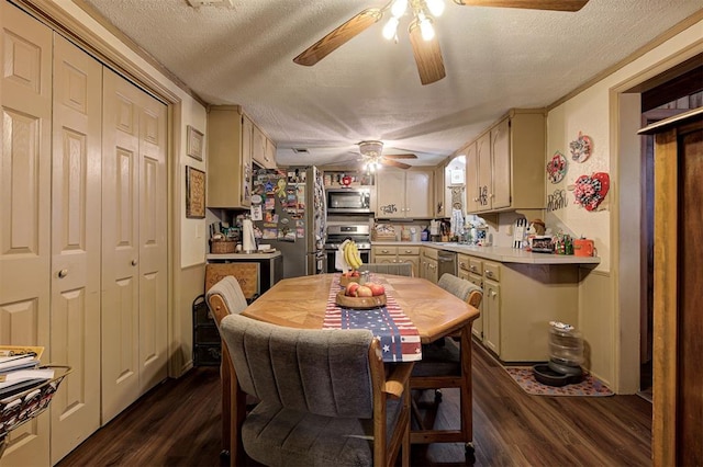 dining space with ceiling fan, dark hardwood / wood-style floors, and a textured ceiling