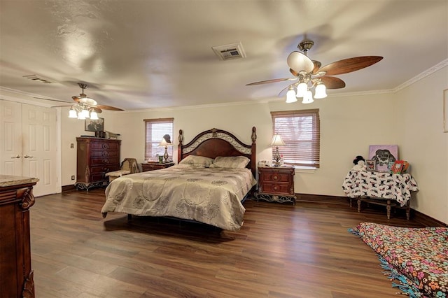 bedroom featuring crown molding, dark wood-type flooring, and ceiling fan