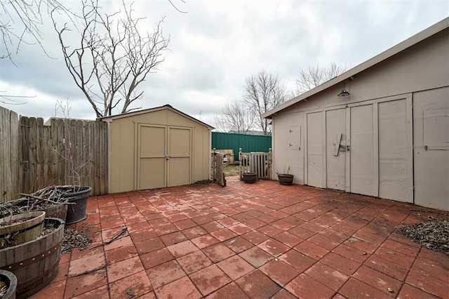 view of patio featuring a storage unit