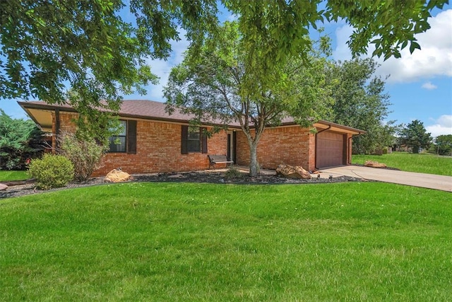 single story home featuring a garage and a front lawn