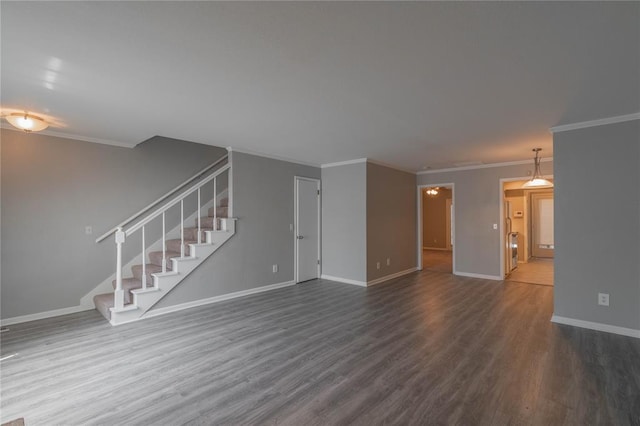 unfurnished living room with crown molding and dark hardwood / wood-style floors