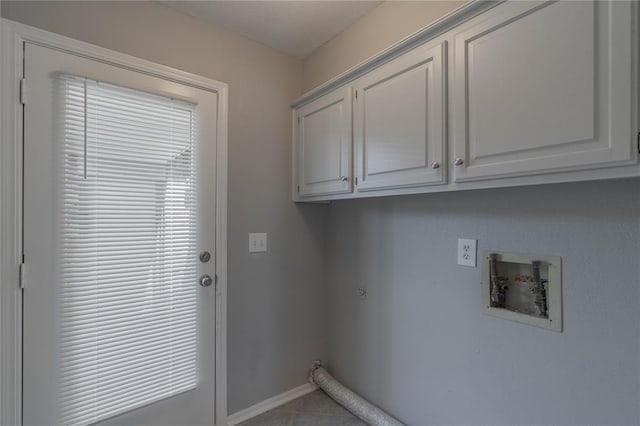 laundry area with cabinets, hookup for a washing machine, and electric dryer hookup