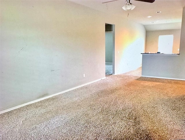 carpeted empty room with ceiling fan