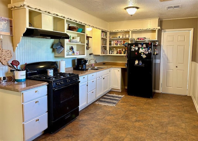 kitchen featuring black appliances, a sink, open shelves, under cabinet range hood, and white cabinetry