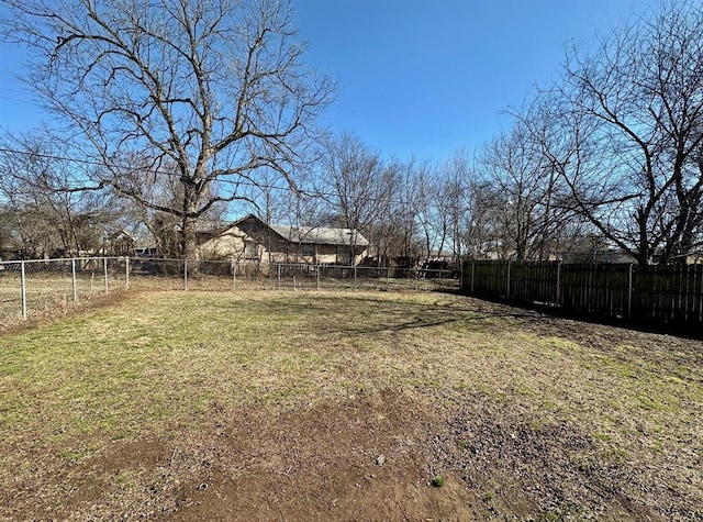 view of yard with a fenced backyard