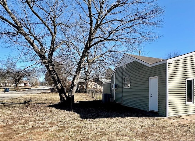 view of side of property with cooling unit