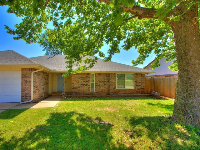 720 Cottonwood Dr, Moore, OK 73160 - ranch-style house with an attached garage, brick siding, and roof with shingles