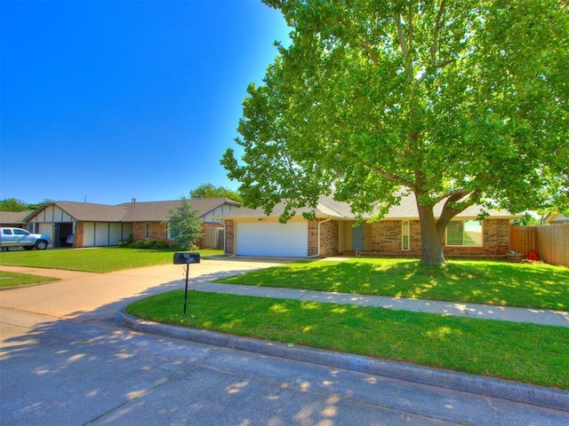 720 Cottonwood Dr, Moore, OK 73160 - view of front of home with brick siding, driveway, and a garage