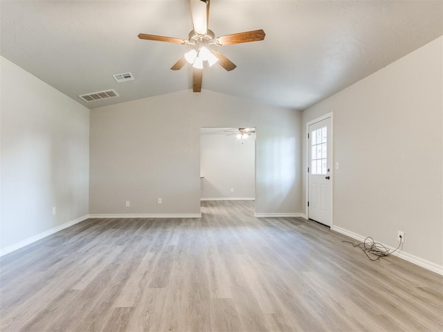 720 Cottonwood Dr, Moore, OK 73160 - unfurnished living room with ceiling fan, light wood-style floors, lofted ceiling, and baseboards