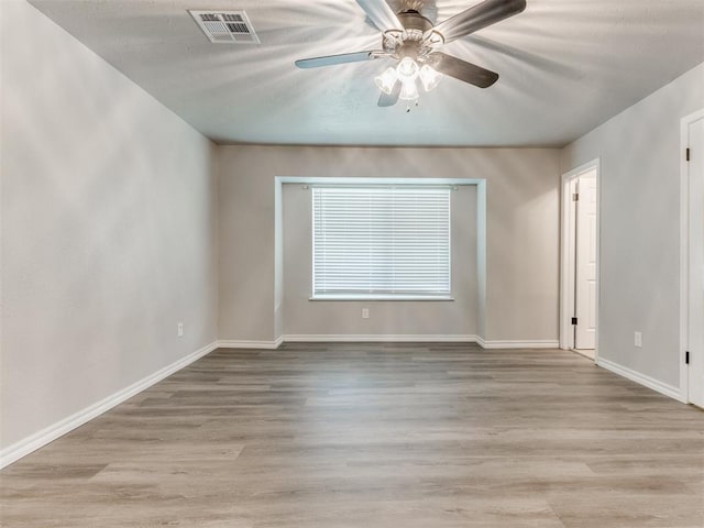 720 Cottonwood Dr, Moore, OK 73160 - unfurnished room featuring baseboards, ceiling fan, and wood finished floors