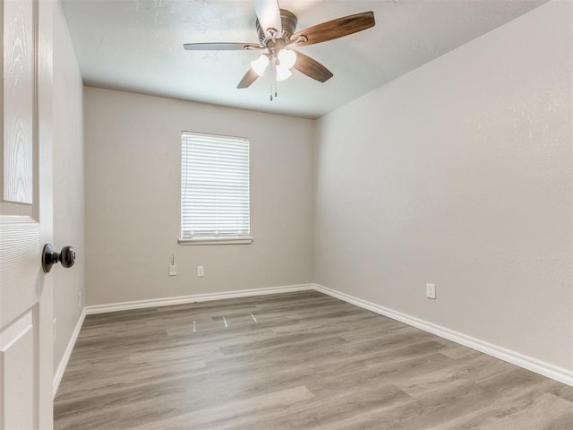 720 Cottonwood Dr, Moore, OK 73160 - unfurnished room featuring ceiling fan, wood finished floors, and baseboards