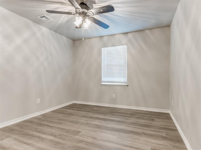 720 Cottonwood Dr, Moore, OK 73160 - empty room with wood finished floors, ceiling fan, and baseboards