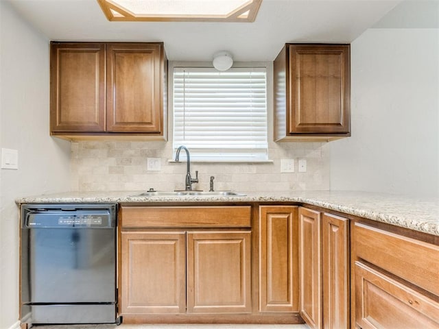 720 Cottonwood Dr, Moore, OK 73160 - kitchen with black dishwasher, a sink, decorative backsplash, and light stone countertops