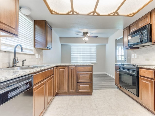 720 Cottonwood Dr, Moore, OK 73160 - kitchen featuring black appliances, a sink, ceiling fan, and tasteful backsplash