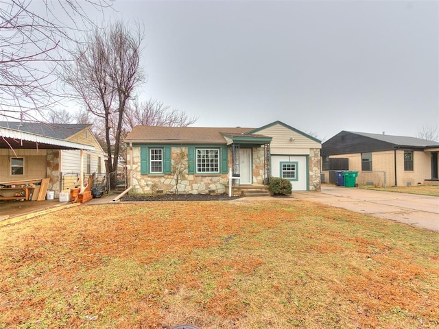 ranch-style house with a front yard