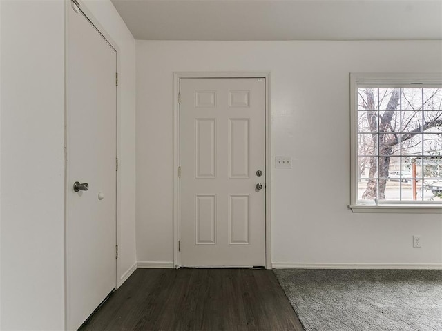 entryway with dark hardwood / wood-style floors