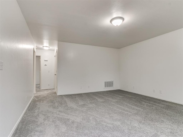 empty room featuring light carpet