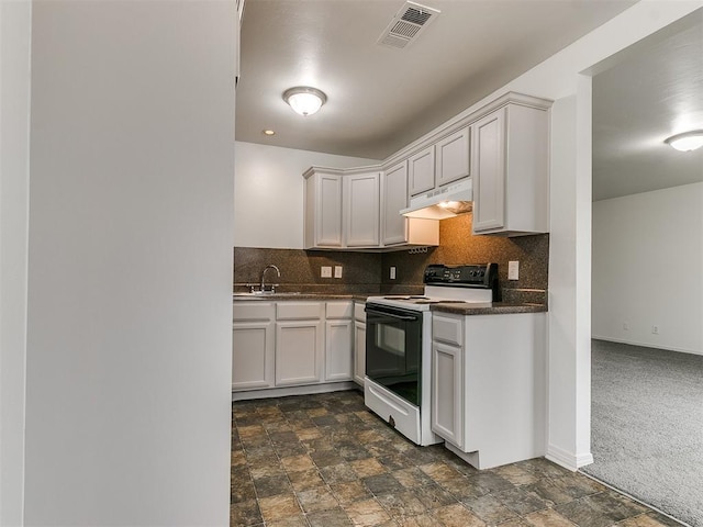 kitchen with electric range oven, backsplash, sink, and white cabinets