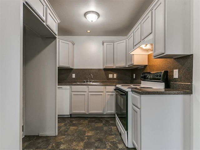 kitchen with dishwasher, electric range oven, and white cabinets