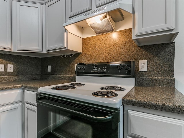 kitchen featuring range with electric cooktop and backsplash