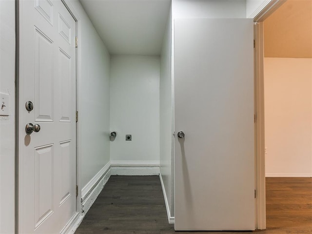 washroom featuring dark hardwood / wood-style flooring and hookup for an electric dryer