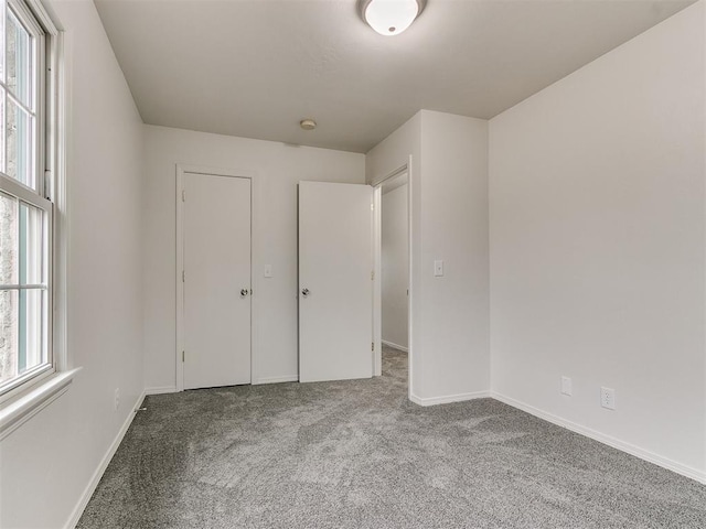 unfurnished bedroom featuring carpet