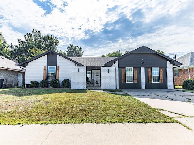 ranch-style house with a front lawn