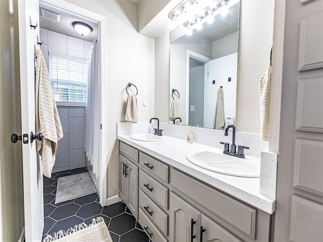 bathroom featuring vanity and tile patterned floors