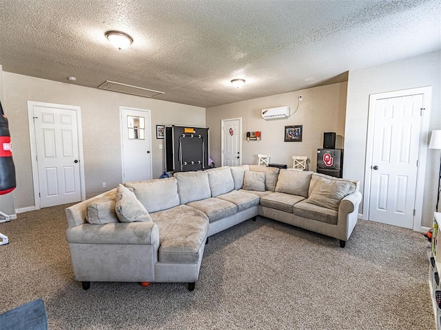 carpeted living room with an AC wall unit and a textured ceiling