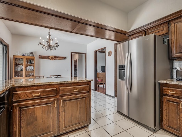 kitchen with pendant lighting, light tile patterned floors, a notable chandelier, stainless steel fridge with ice dispenser, and dark brown cabinets