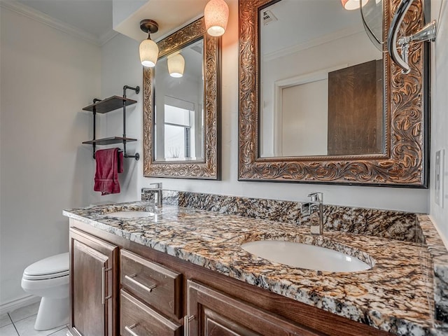 bathroom with vanity, tile patterned floors, ornamental molding, and toilet