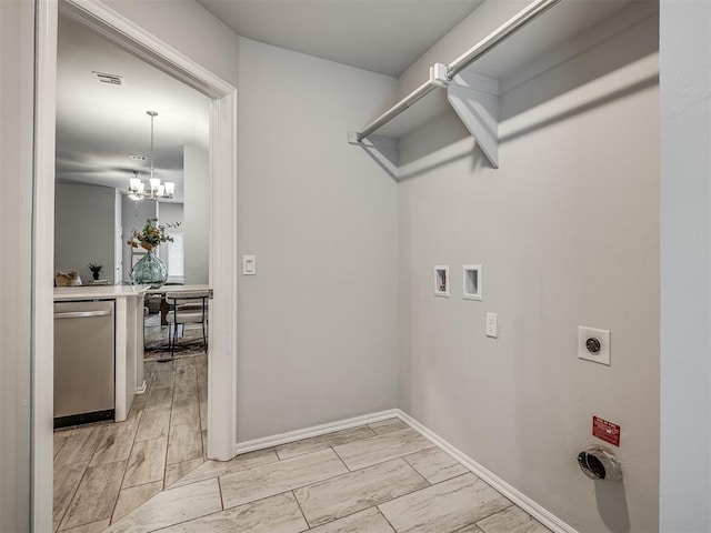 laundry area with a notable chandelier, hookup for a washing machine, and electric dryer hookup