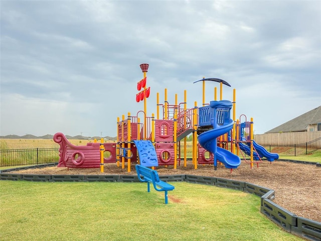 view of play area featuring a lawn