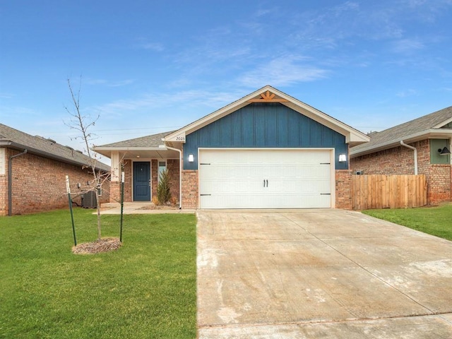 single story home with a garage, central AC, and a front lawn