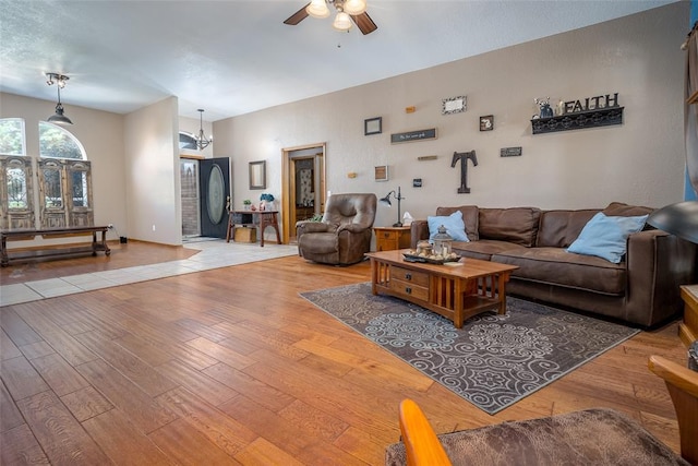 living room featuring ceiling fan and light wood-type flooring