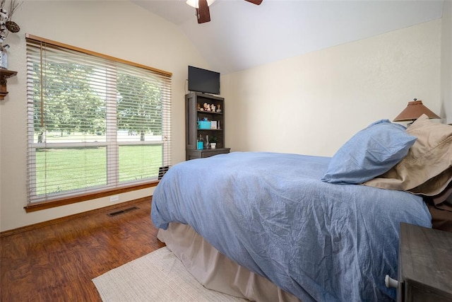 bedroom featuring dark wood-type flooring, ceiling fan, and lofted ceiling