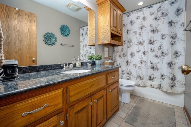 full bathroom with vanity, toilet, and shower / tub combo