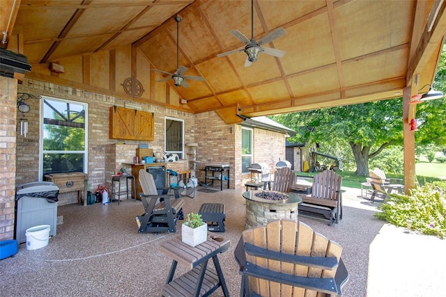 view of patio with a gazebo, ceiling fan, and an outdoor fire pit