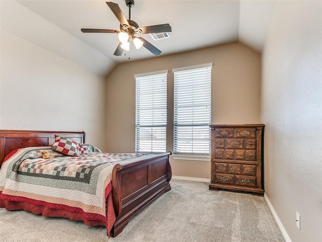 carpeted bedroom featuring ceiling fan and vaulted ceiling