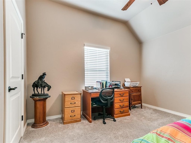 carpeted office featuring lofted ceiling and ceiling fan