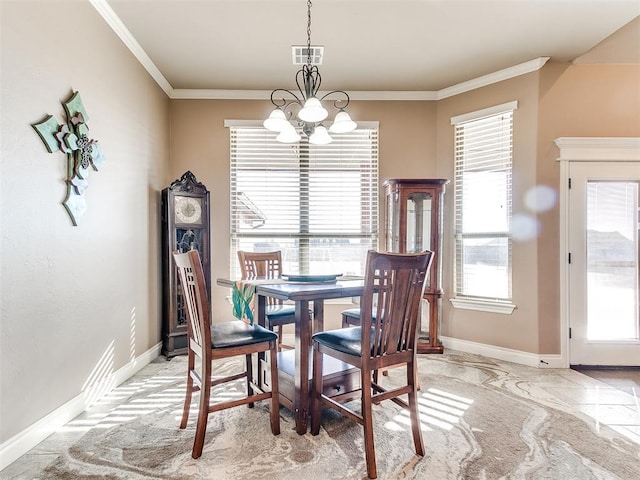 dining space with a notable chandelier and crown molding