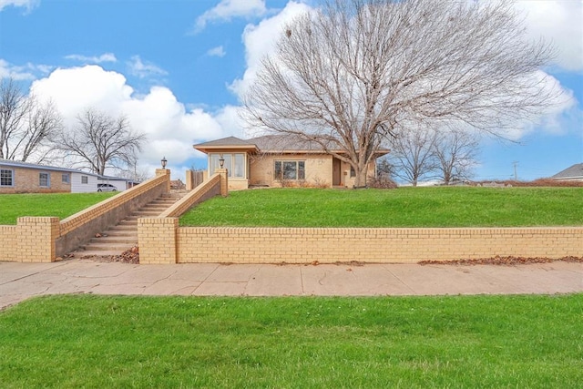 view of front of home with a front lawn