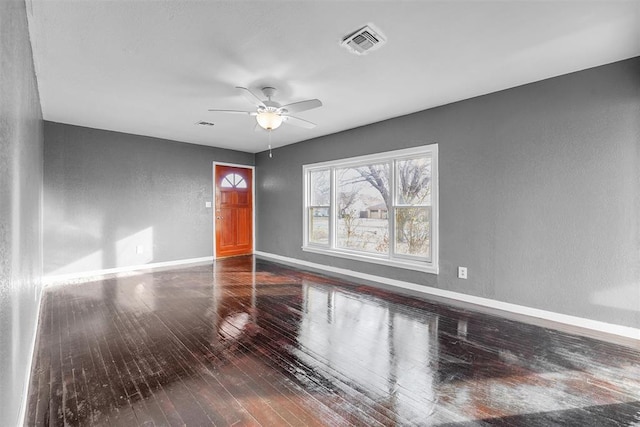 unfurnished room with hardwood / wood-style flooring and ceiling fan