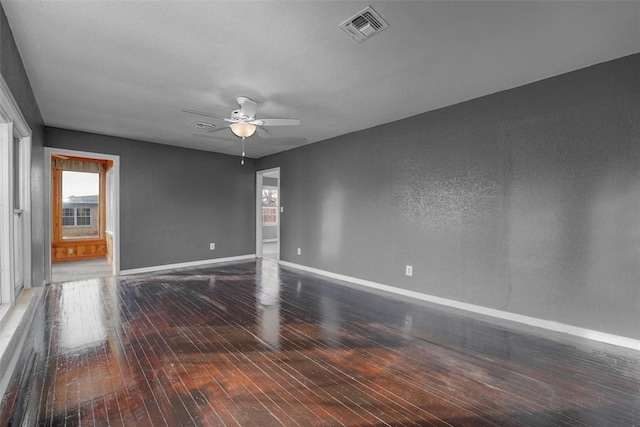 empty room featuring wood-type flooring and ceiling fan