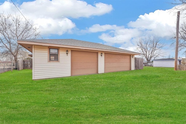 garage with a lawn