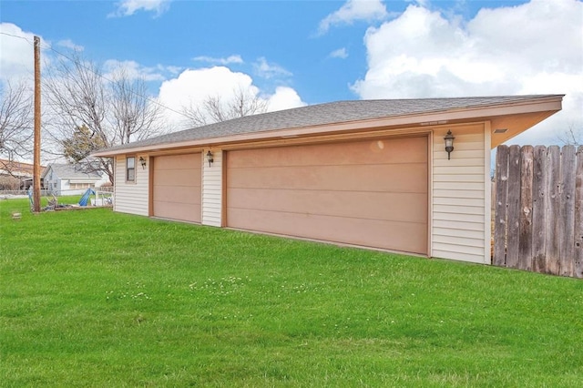 garage featuring a yard