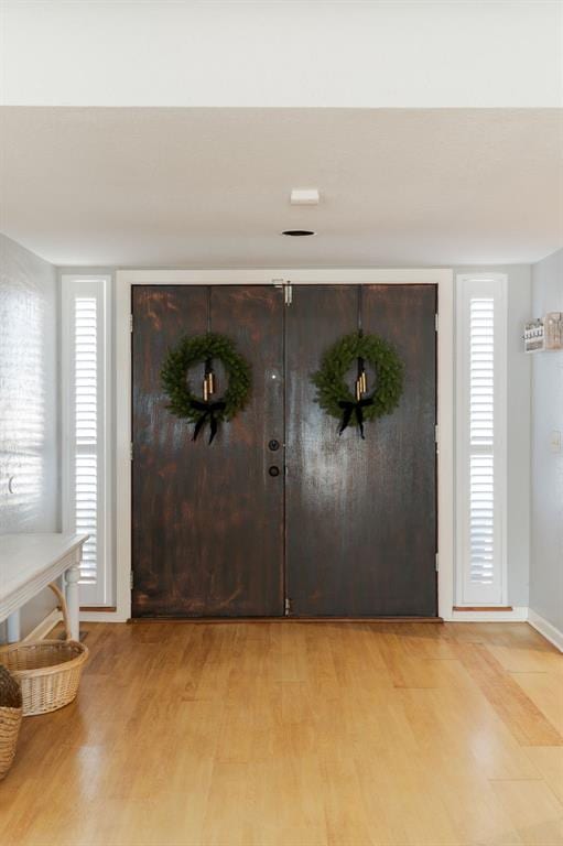 foyer with light hardwood / wood-style flooring