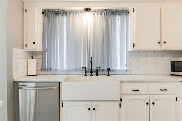 kitchen featuring white cabinetry, stainless steel appliances, and sink